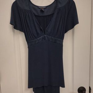 Flattering navy blue top, plunging neckline, back tie. EUC.